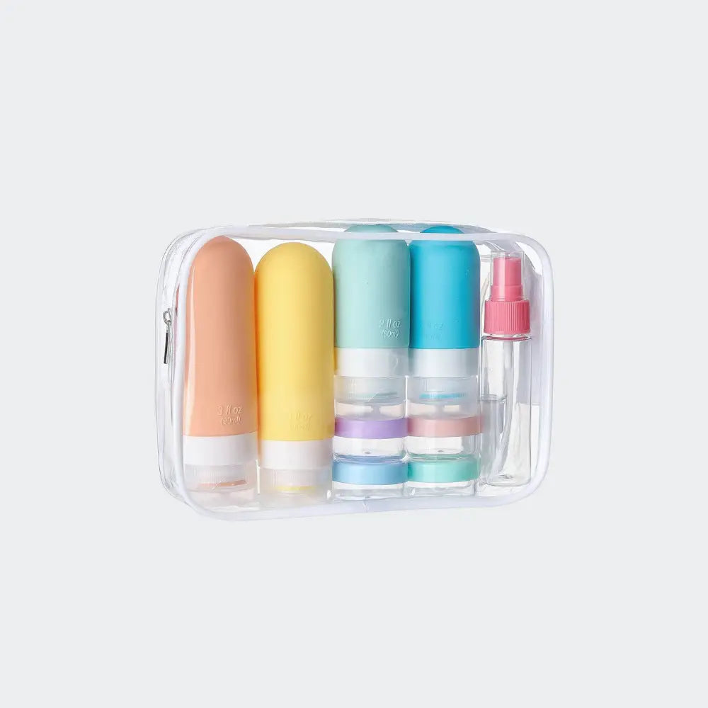 trousse de toilette transparente complete avec tubes et flacons de voyage